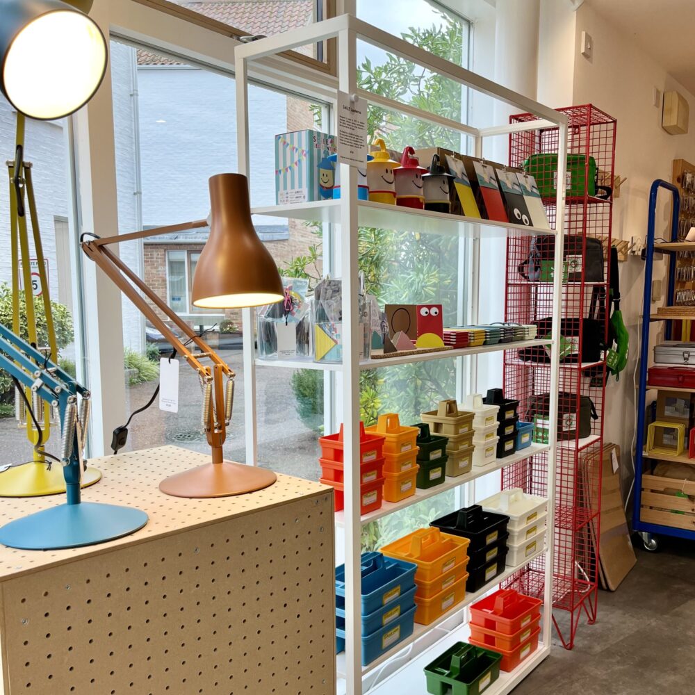 Brightly coloured stationery and anglepoise lamps make a colourful presentation in the shop window at Lift